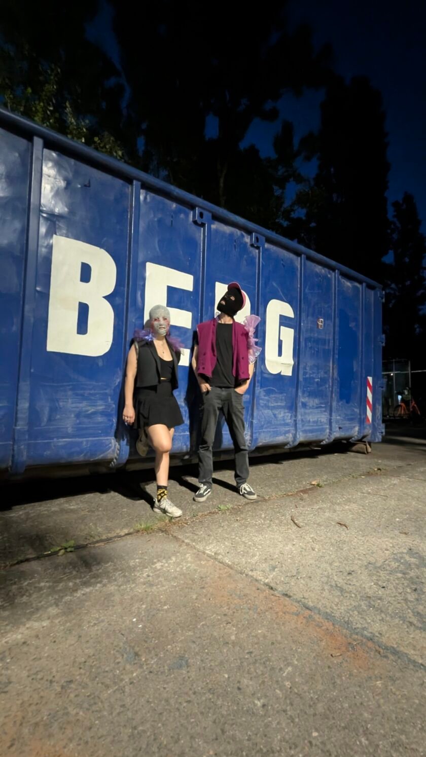 standing in front of container